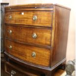 A Regency mahogany bow fronted chest, fitted three long drawers, over a brushing slide W.93cm