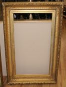 A 19th century gilt gesso picture frame, aperture 80 x 44cm