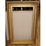 A 19th century gilt gesso picture frame, aperture 80 x 44cm