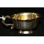 A late 18th century Russian silver gilt vodka cup, of cusped oval form with engraved foliate