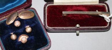 A 9ct gold cufflink, a cased four piece gold plated dress stud set and unmarked gold bar brooch/