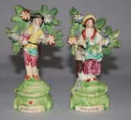 A pair of Staffordshire pottery figures incised "Gardeners", c.1830, 5.5in. (damage to bocage)