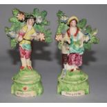 A pair of Staffordshire pottery figures incised "Gardeners", c.1830, 5.5in. (damage to bocage)