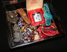 A lacquer box of mixed jewellery