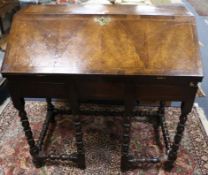 The upper portion of an early 18th century herringbone crossbanded bureau with fitted interior,
