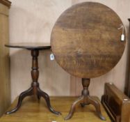 Two George III oak tripod tables, W.66cm H.53cm