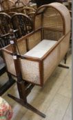 A Victorian mahogany and wicker framed cradle, raised on a stand, H.104cm