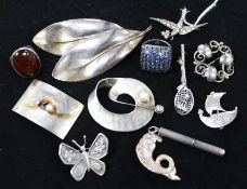 A silver bird brooch and other silver brooches including Scandinavian.