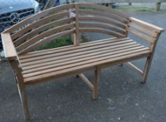 A modern teak bow back garden bench, W.162cm