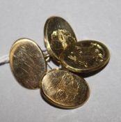 A pair of 18ct gold oval cufflinks, three panels engraved with butterfly or monogram and inscribed