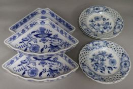 A set of four Meissen blue and white dessert dishes and three hors d'oeuvres fan shaped supper