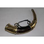 A 19th century Moroccan engraved and pierced brass powder horn