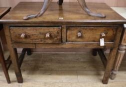 An oak side table, fitted two short drawers W.107cm