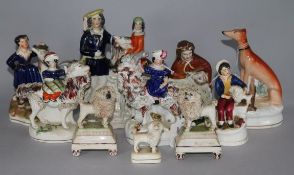 A pair of small Staffordshire poodles, six other Staffordshire figures, a flatback and an inkwell (