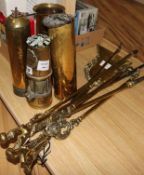 A selection of Victorian fire brasses, brass shell cases, a brass mortar, etc.