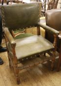 A leather studded elbow chair