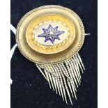 A Victorian gold enamel and seed pearl oval tassel brooch, 1.5in.