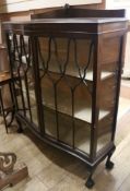 A mahogany serpentine display cabinet, W.107cm