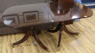 A Regency mahogany extending twin pillar dining table, W.165cm