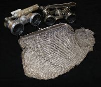 A pair of mother of pearl opera glasses, one other pair and two silver mesh purses.