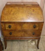 A 1950's walnut bureau