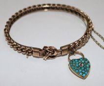 A late Victorian 9ct gold hinged bangle with diamond and turquoise set heart shaped padlock.