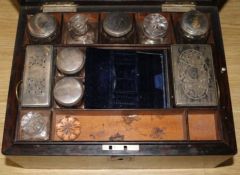 A Victorian mother of pearl-inlaid rosewood dressing case, with plate-mounted part fitments (some