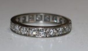 A gold and diamond full eternity ring, size M.