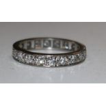 A gold and diamond full eternity ring, size M.