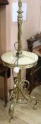 An early 20th century brass and onyx standard lamp table, H.135cm