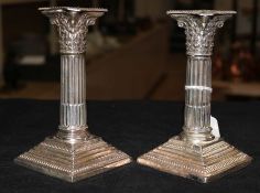 A pair of Victorian silver Corinthian column dwarf candlesticks, Sheffield 1899, Cooper Bros (