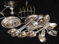 Various Georgian and later silver teaspoons, a small toast rack, two pin trays, a small trophy