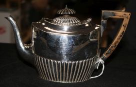 A silver oval teapot, half-fluted, London 1903, Carrington & Co