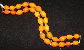 A single strand oval amber bead necklace with spacers, gross weight 20 grams, 15.5in.