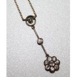 An Edwardian gold, silver and diamond cluster drop pendant necklace, on a fine link gold chain