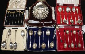 A cased silver butter dish and knife set, 3 sets of silver coffee spoons, a part set and 6