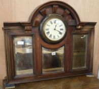 An overmantel mirror with clock insert, W.90cm