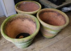 Three large terracotta pots, W.55cm