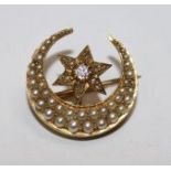 A Victorian gold, diamond and seed pearl set crescent brooch, 0.75in.