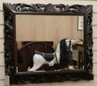 A carved oak frame mirror, W.70cm