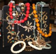 A quantity of costume jewellery and two evening bags.