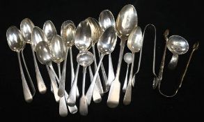 A collection of silver tea and other spoons and a caddy spoon, Georgian and later