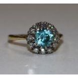 An 18ct blue zircon and diamond cluster ring, size M.
