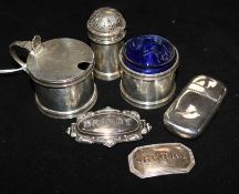 Three silver condiments and three other items.