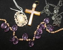 A 19th century seed pearl mourning brooch, two necklaces and a cross pendant.