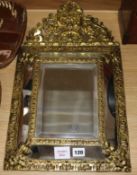 A Dutch brass mounted mirror