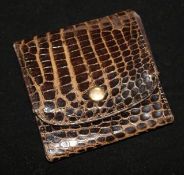 A small leather 'crocodile skin' purse with Gucci label, 8cm sq.