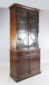 A George III mahogany secretaire bookcase, with two astragal glazed doors over fall front, drawer