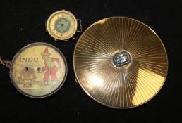 A German tinplate 'Indu' optical illusion toy, Lehmann, c 1933, a 9ct gold-cased watch (a.f) and a