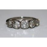 A 1940's/1950's 18ct white gold and graduated five stone diamond ring, size J.